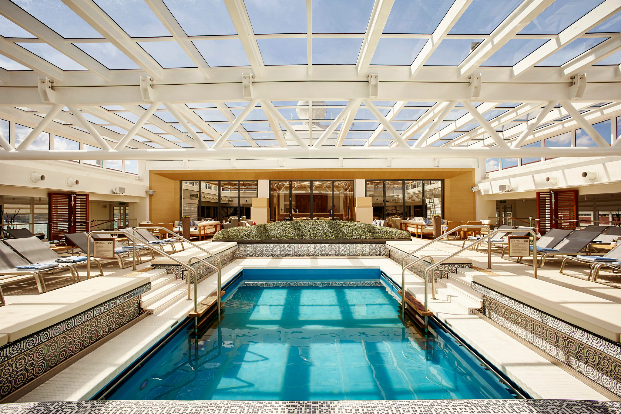a pool and deck on a cruise ship
