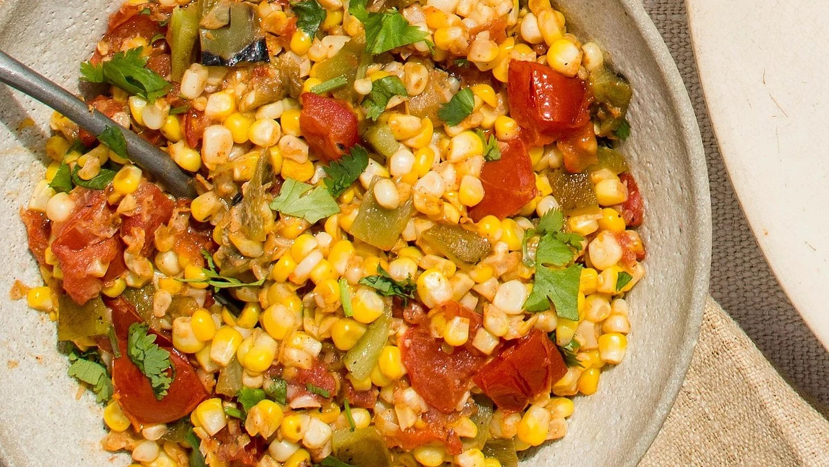 A close-up view of sweet corn salad in a bowl