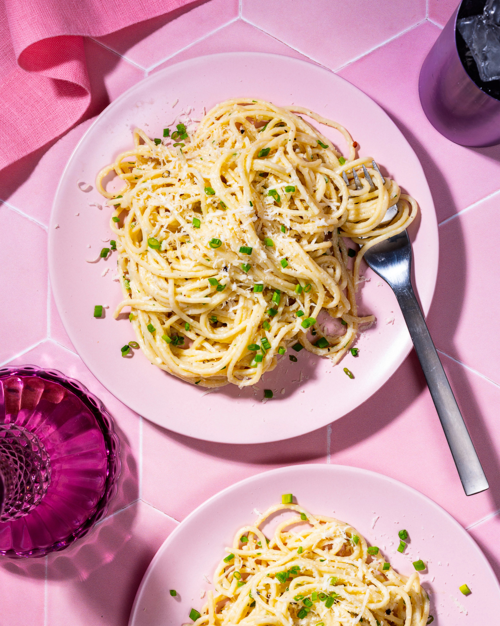 Overhead view of Three Cheese Spaghetti on pink background