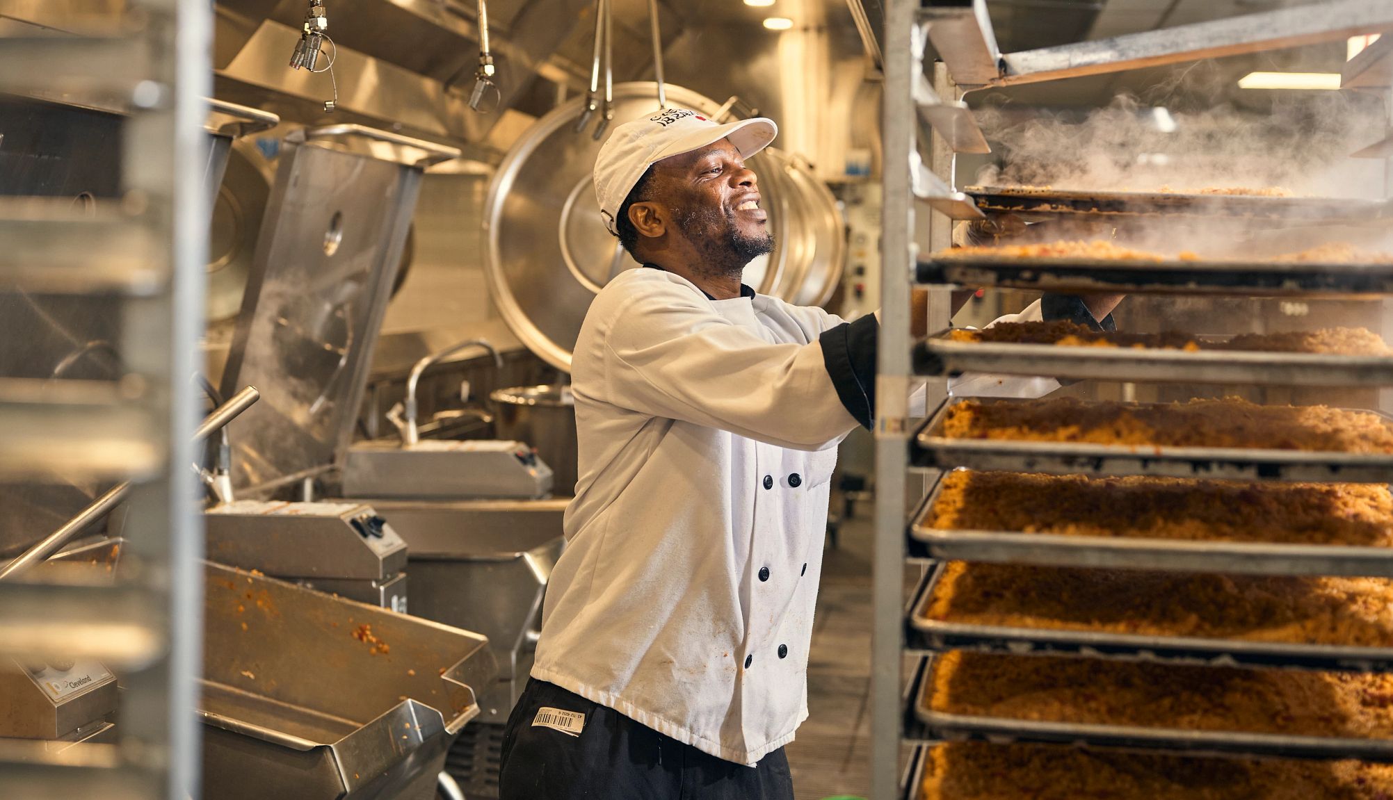 How to Create Healthy Meals at Home for a Loved One a person putting food on a cooling rack