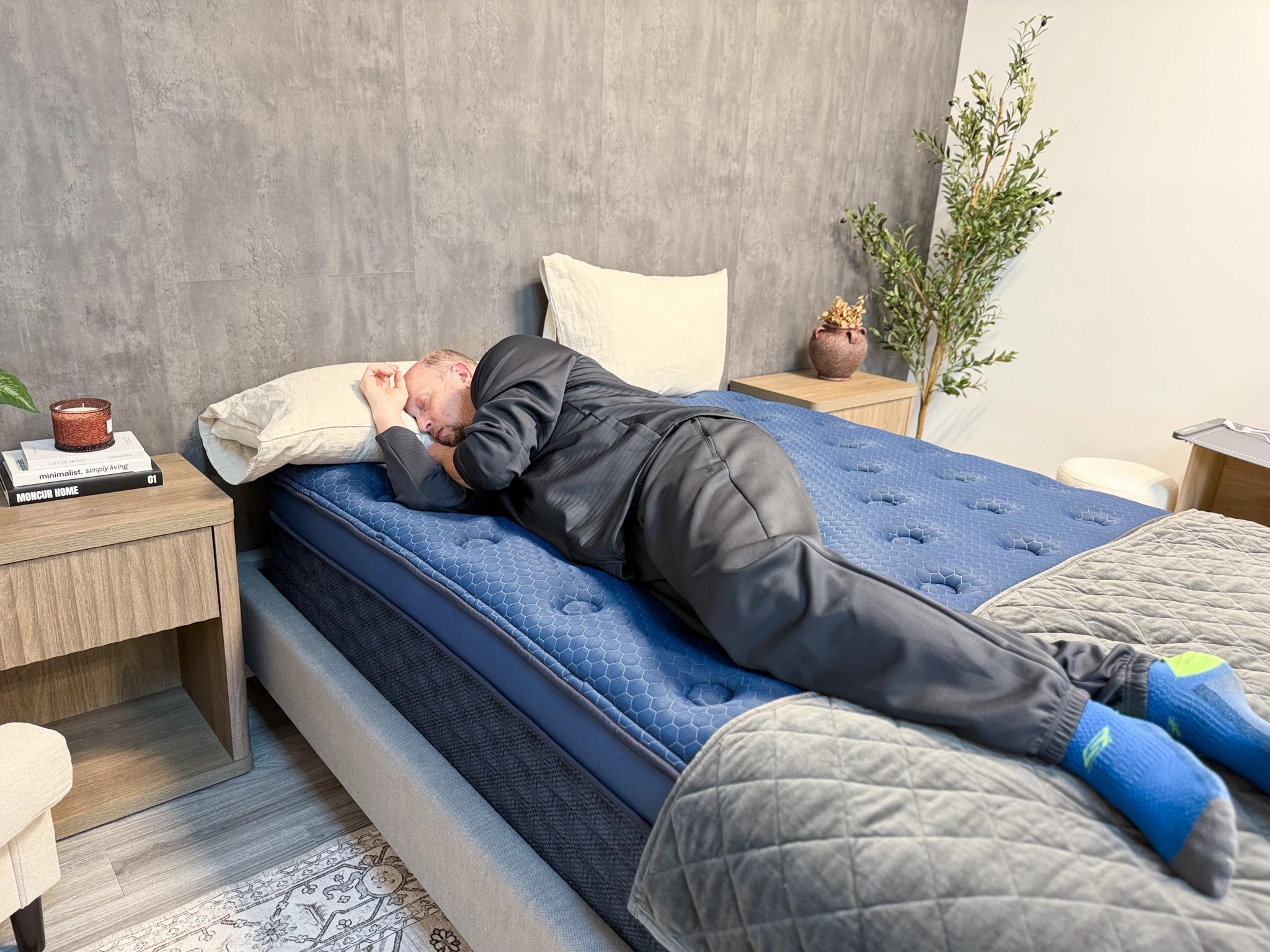 A man lying on his side on the Brooklyn Bedding Signature mattress