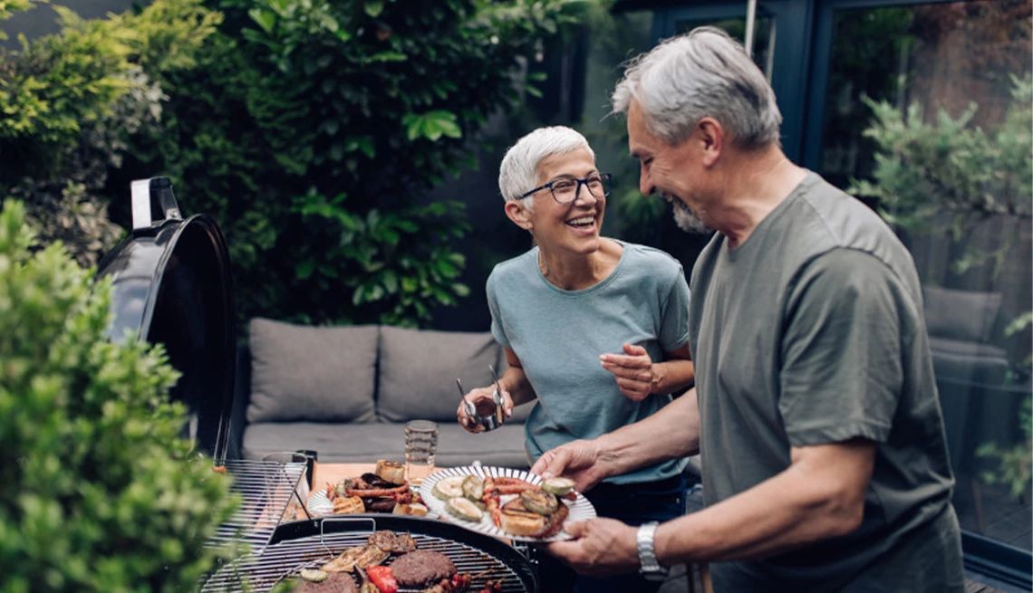 Couple enjoying a backyard barbeque