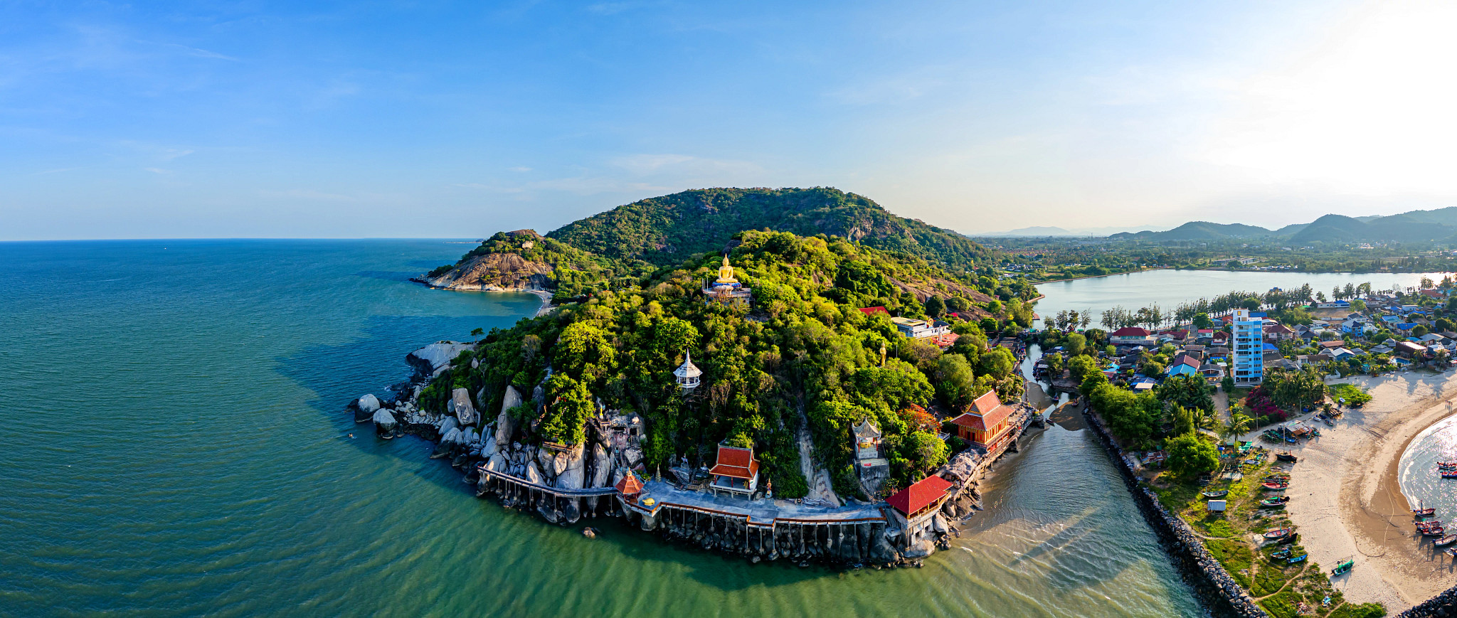 Aerial view of Green Khao Tao mountain and Wat Tham temple in Hua Hin, Thailand