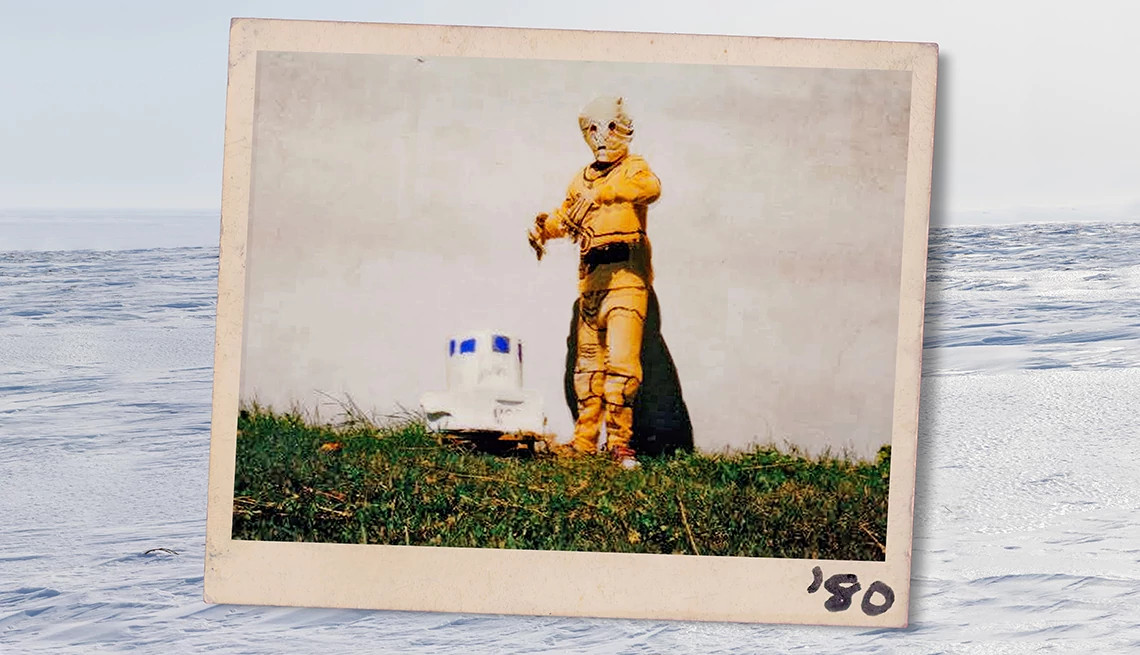 a child dressed in a homemade c-3po costume