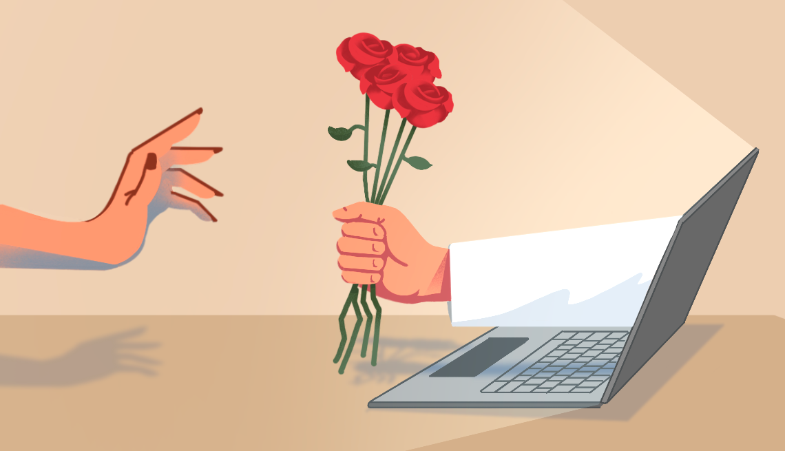 an arm holding roses reaches out of a computer screen