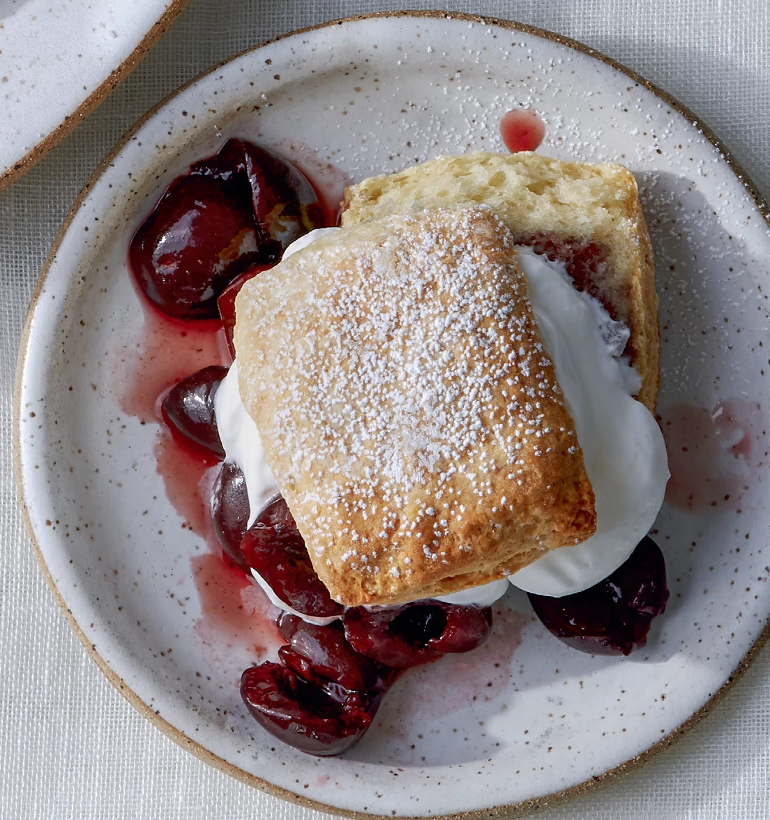 Cherry Shortcake with whipped cream on a plate
