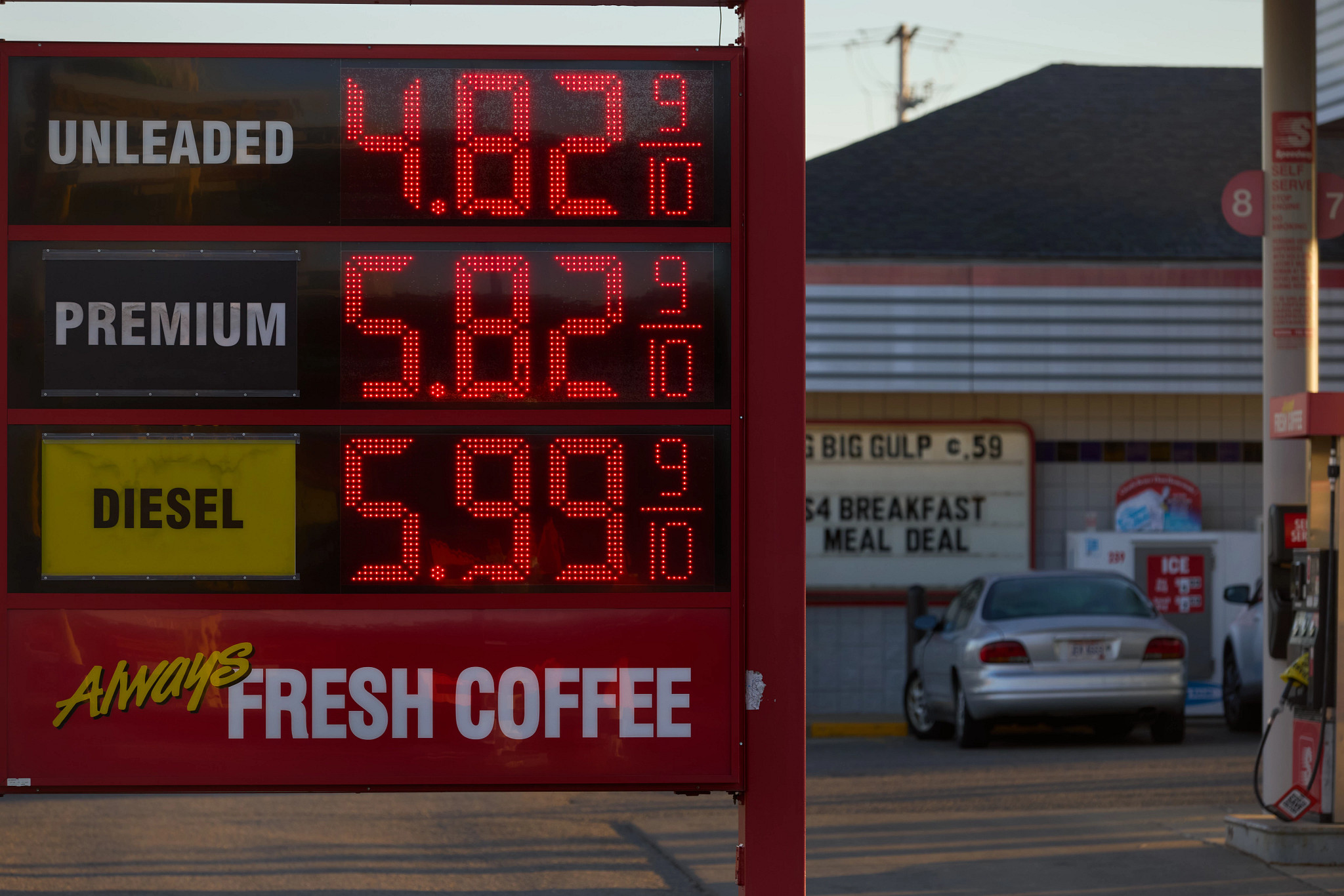 a gas station sign displaying fuel prices