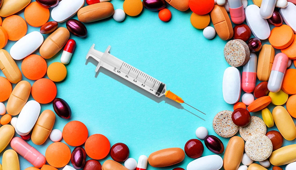 Flu Shot Drug Interactions syringe surrounded by various pills and capsules