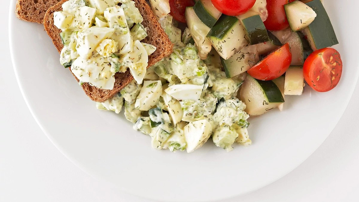 A close-up view of fresh egg salad on a plate