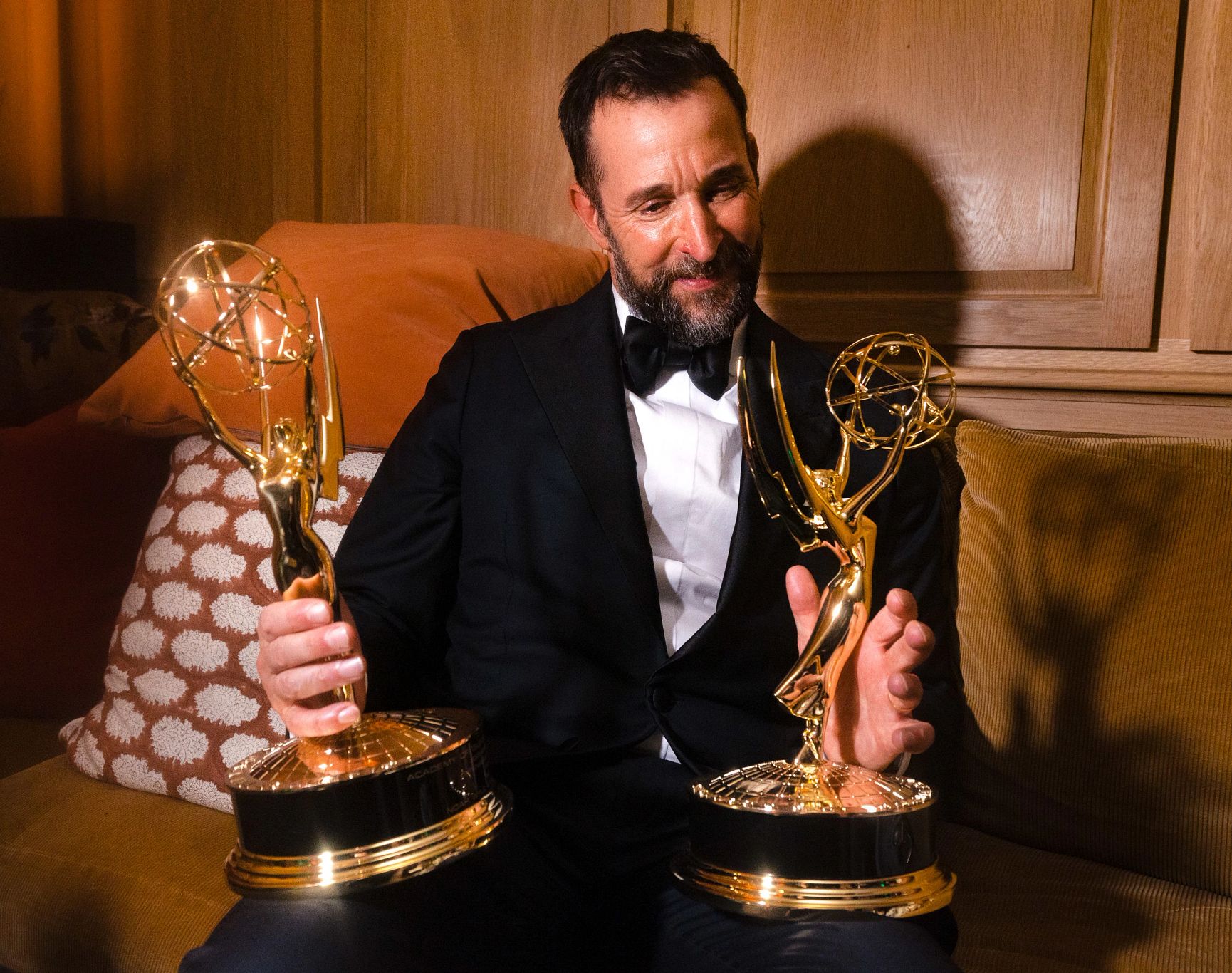 Noah Wyle Wins His First Emmy Award noah wyle admiring two emmy awards