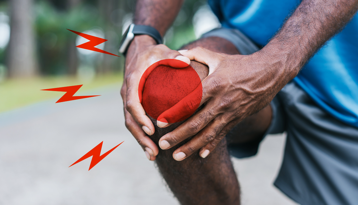 A Man Holding His Inflamed Knee a person in workout clothes gripping their inflamed knee while kneeling on the sidewalk