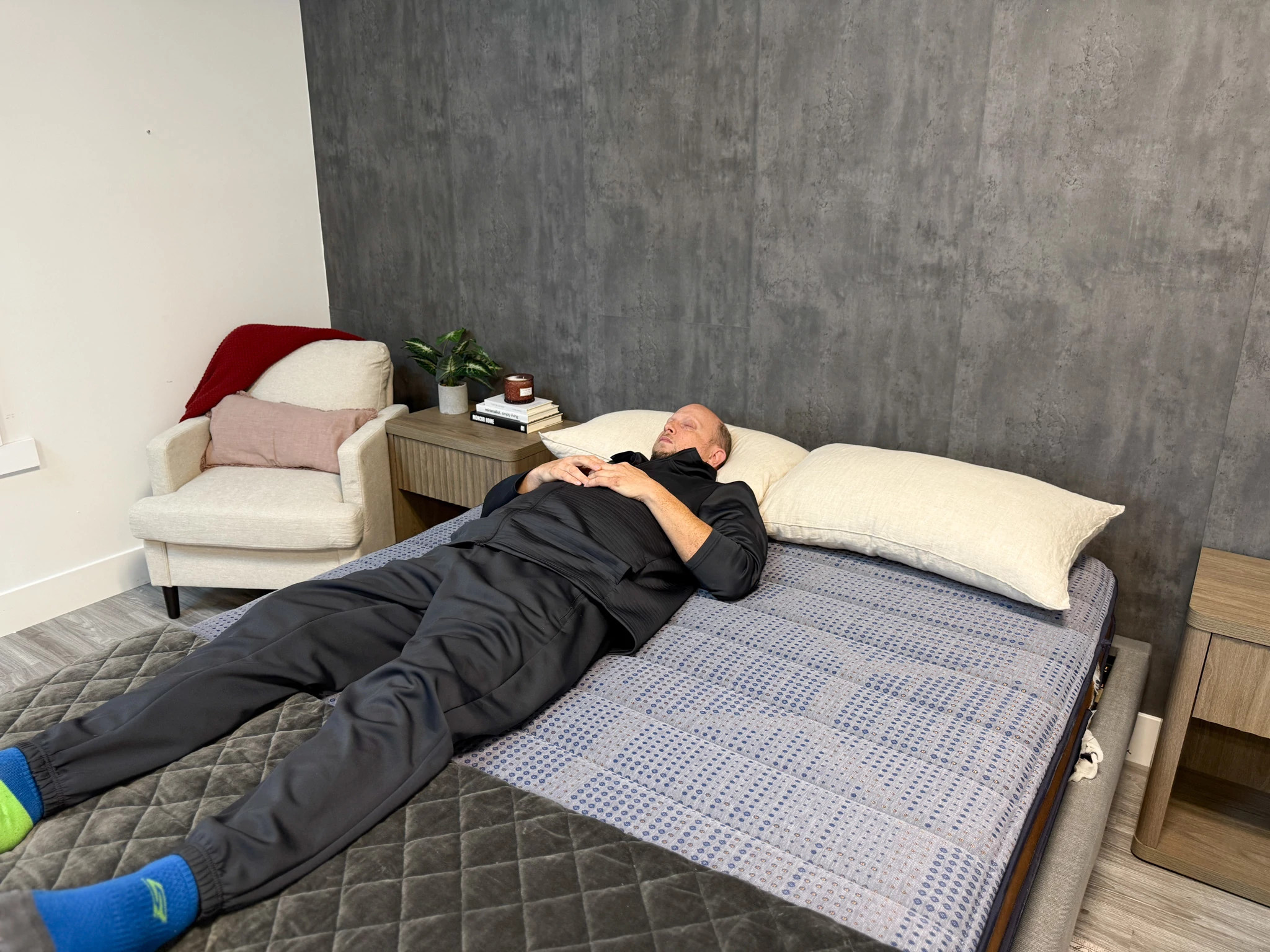 A man lying on the Brooklyn Bedding CopperFlex mattress