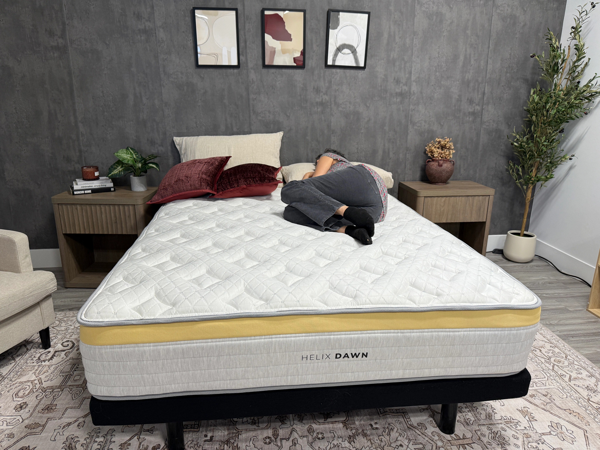 A woman side-sleeping on the Helix Dawn mattress in a bedroom
