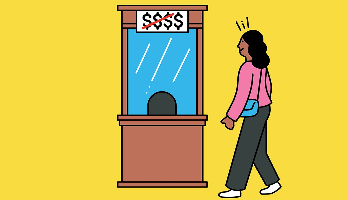 a person walks up to a movie theater ticket counter