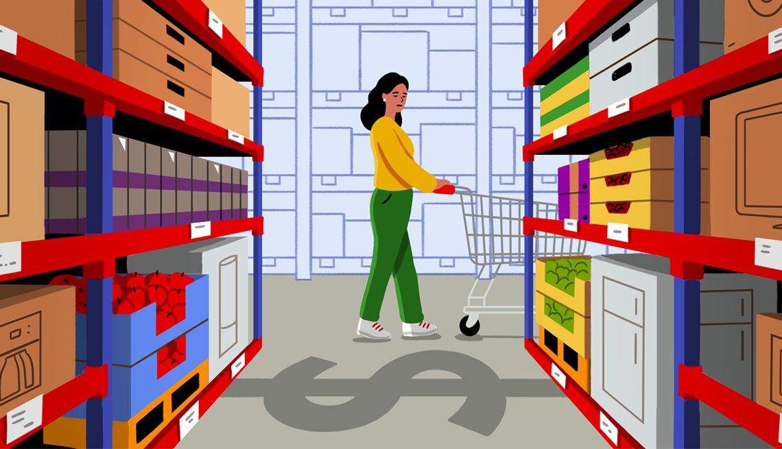 Warehouse Club Shopping Mistakes a woman pushing a cart passes an aisle in a warehouse club