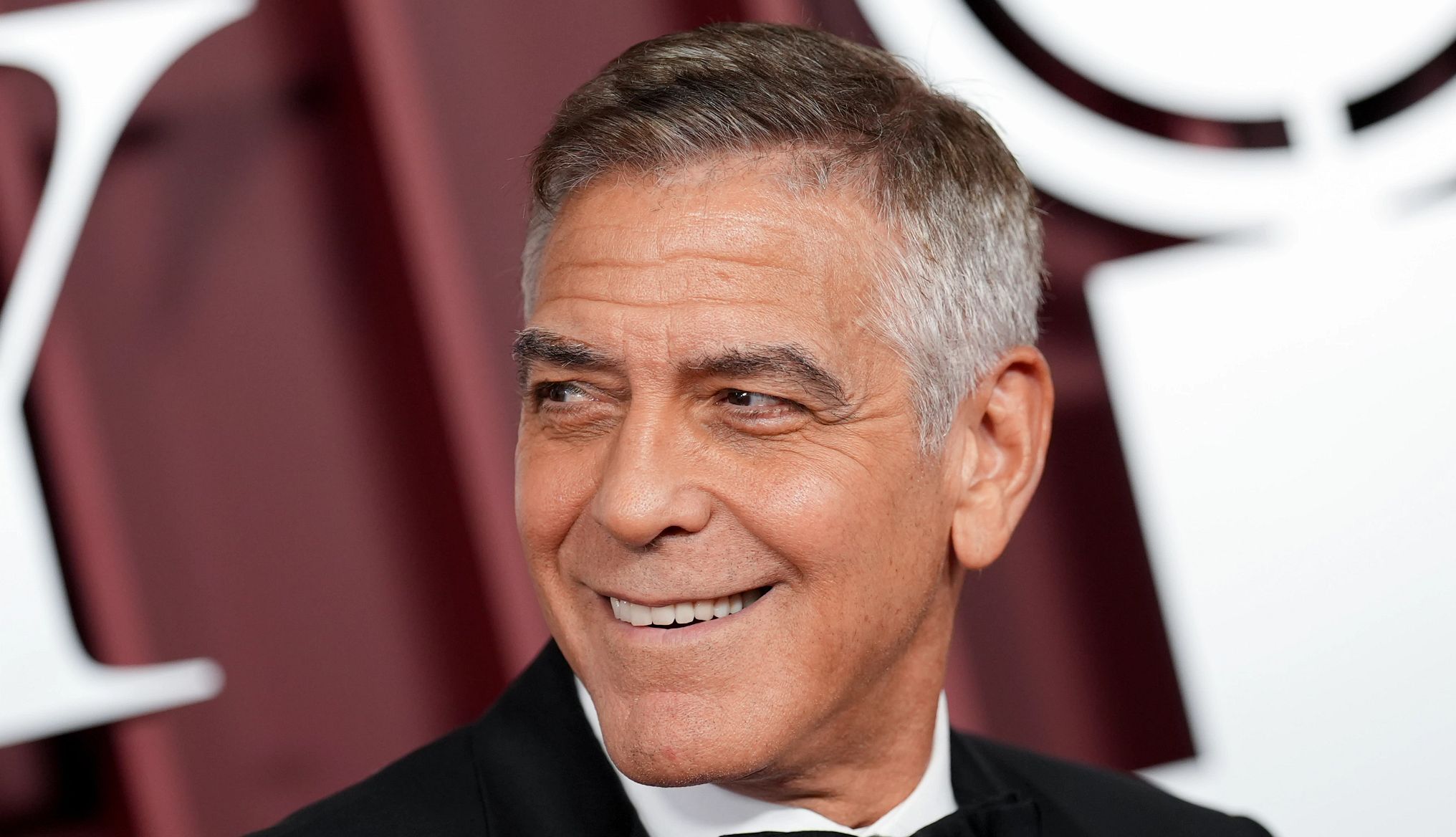 George Clooney Has a Tip for Older Actors george clooney smiling at an event