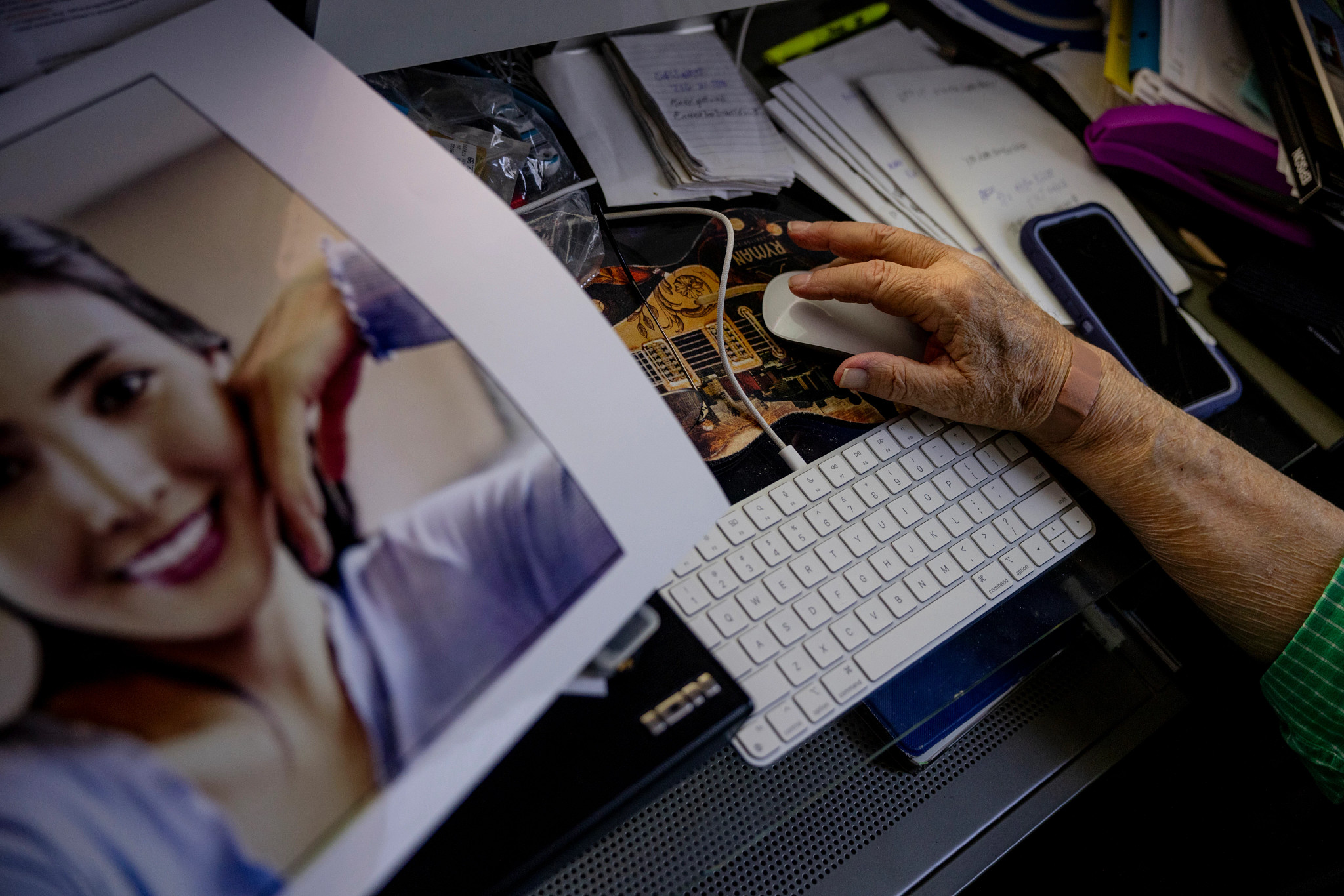 a close up of a man working on a computer, next to an a i generated image of a woman
