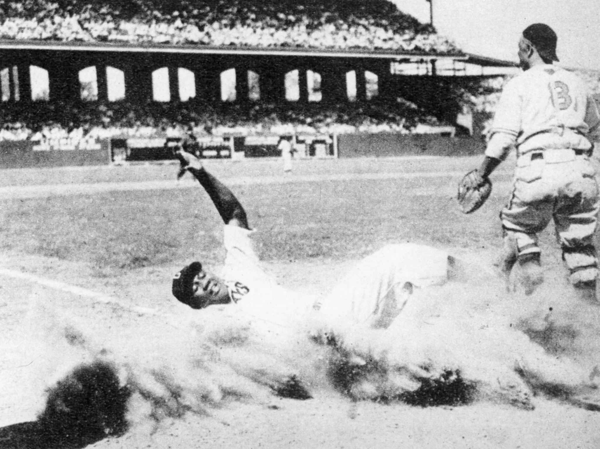 josh gibson slides into home plate in nineteen fourty four.