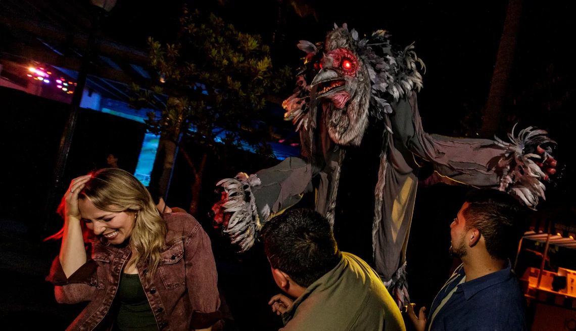 Universal Studios Hollywood Group of adults getting startled by spooky Halloween animantronics at Universal Studios Hollywood