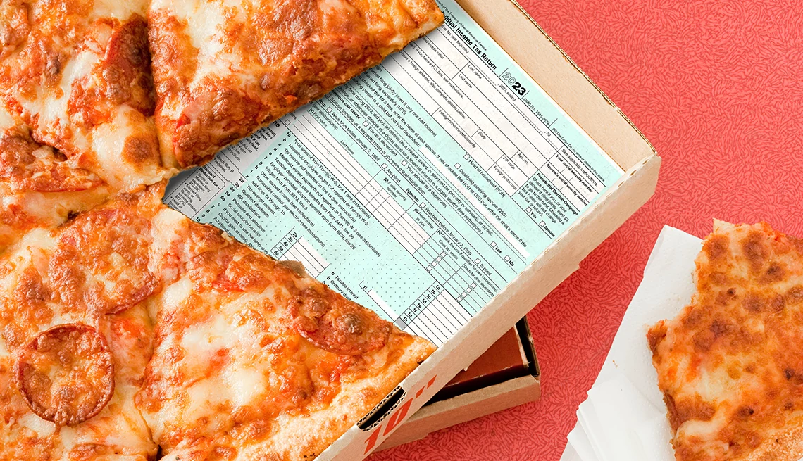 tax day discounts and freebies a pizza pie on top of a tax form