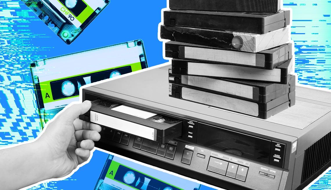 Watch old VHS tapes a hand placing tapes into an old vcr