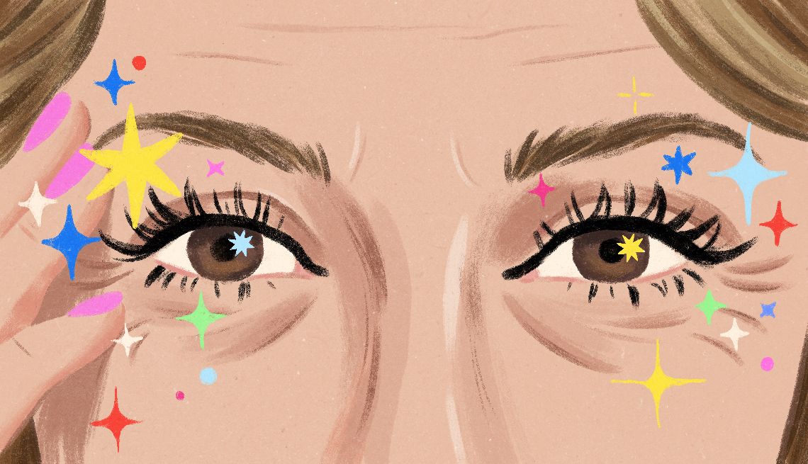 How This Little Beauty Trick Changed My Life a close-up of a person's eyes with colorful sparkles around the eyelashes