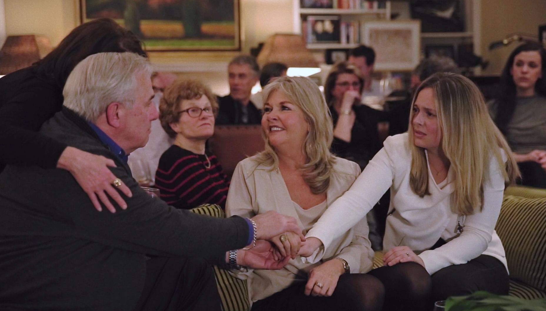 The family of Kathleen McCormack Jim McCormack, Sharon McCormack and Liz McCormack holding their hands together