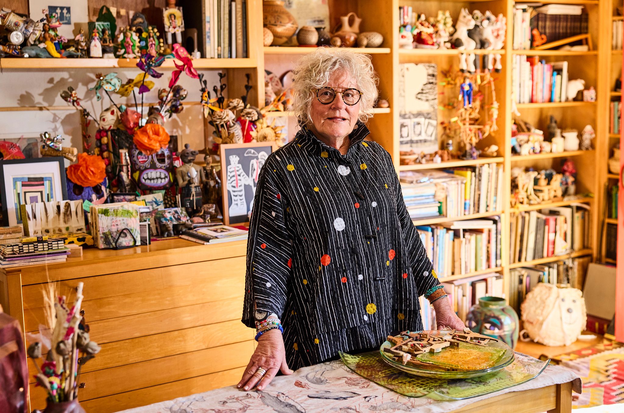 Using a Ride-Share App for the First Time jane gregorius stands in her home studio, surrounded by art