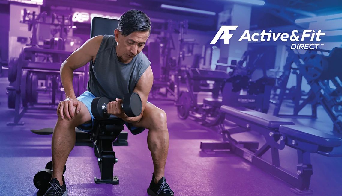 Active and Fit Direct Stylized image of a man doing bicep curls in the gym with purple background and the Active and Fit Direct logo overlaid