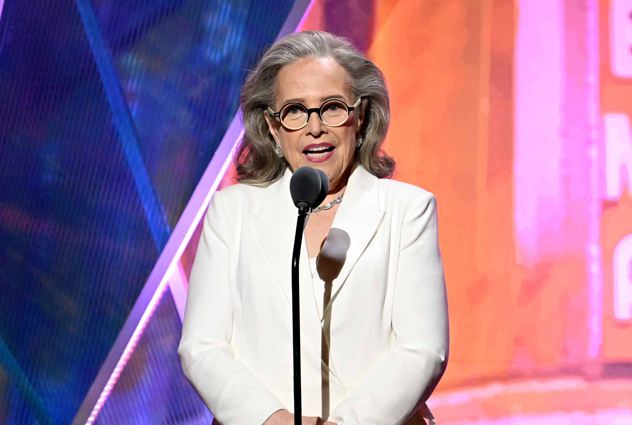 Kathy Bates acccepting an award onstage