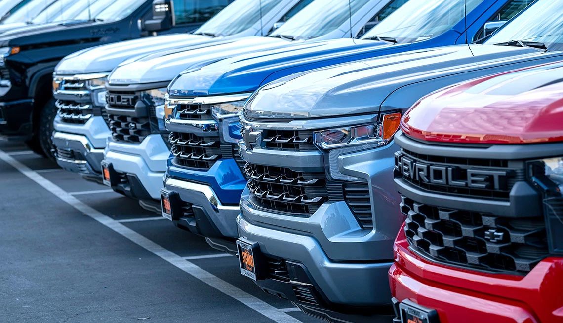 Nearly 820,000 GMC, Chevrolet Pickup Trucks Recalled a row of trucks