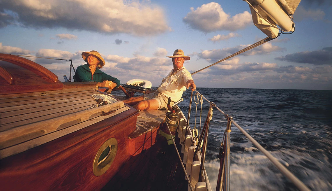 Mature Couple Sailing Vintage Yacht off Florida, AARP Member Benefits Insurance