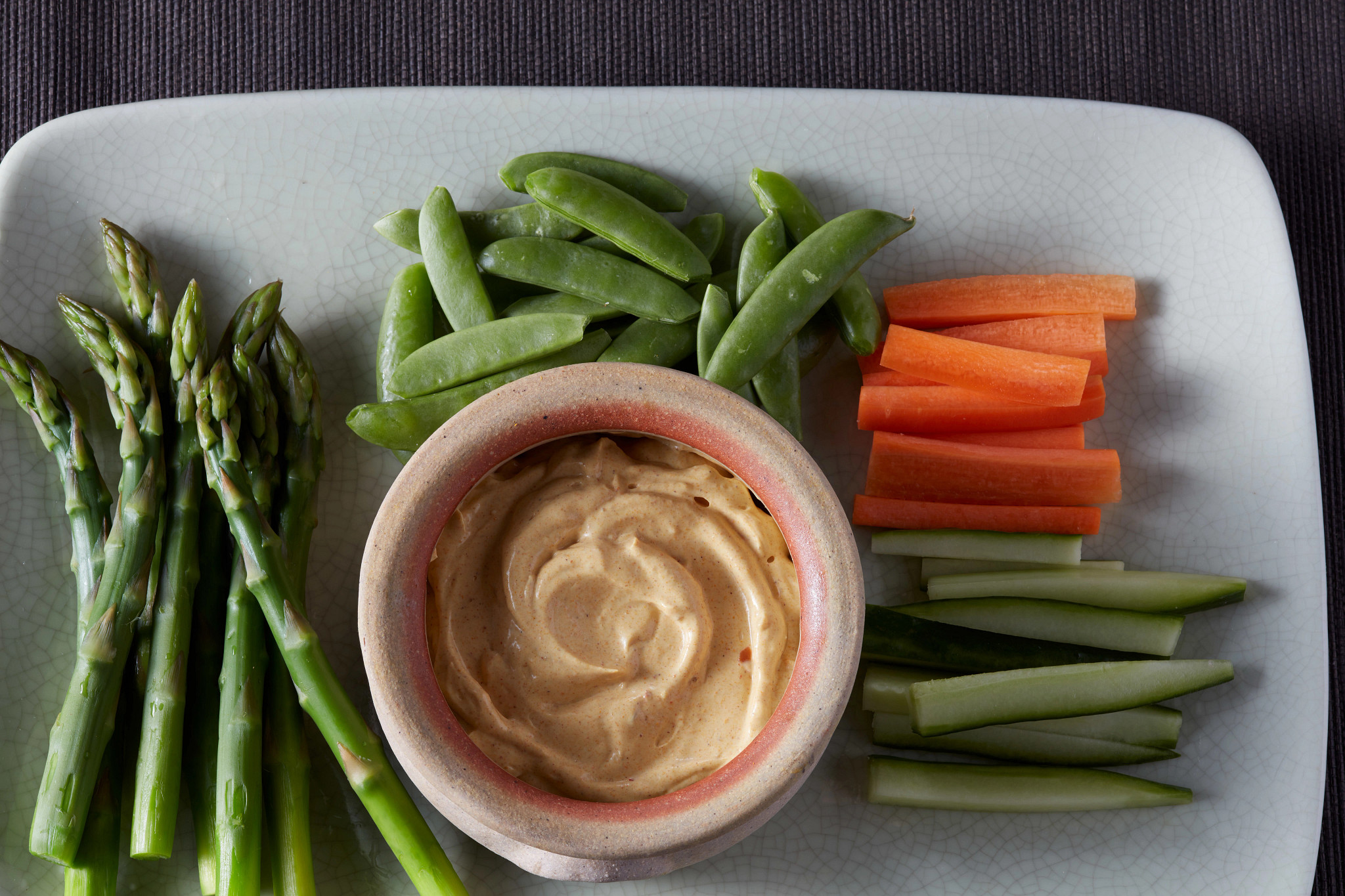 A close-up view of vegetables with curry dip