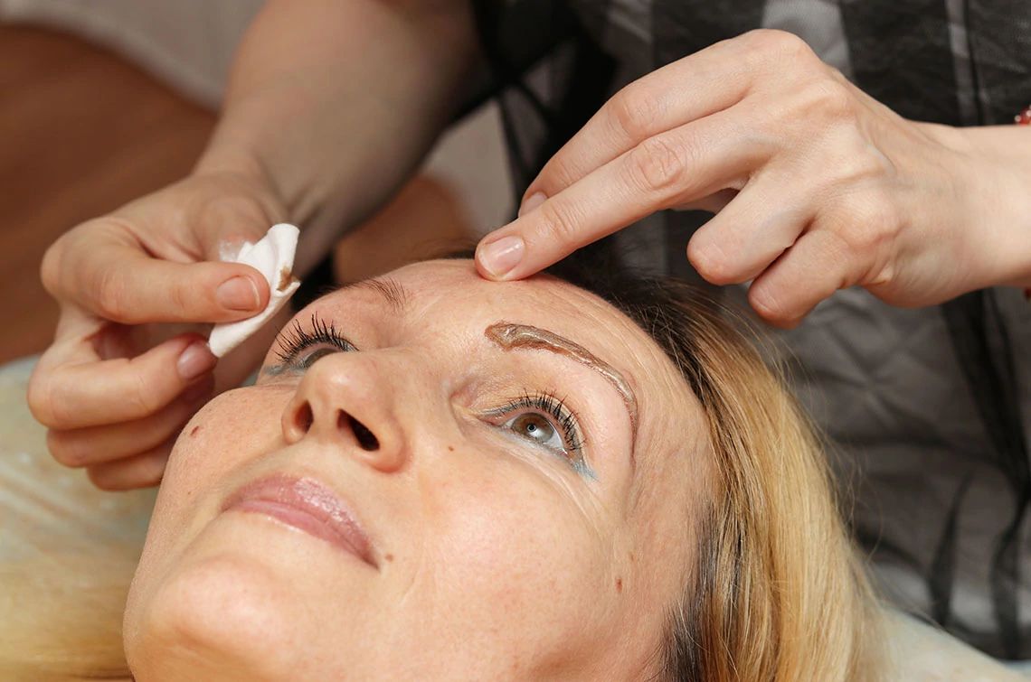 Tinted eyebrows A woman getting her eyebrows tinted