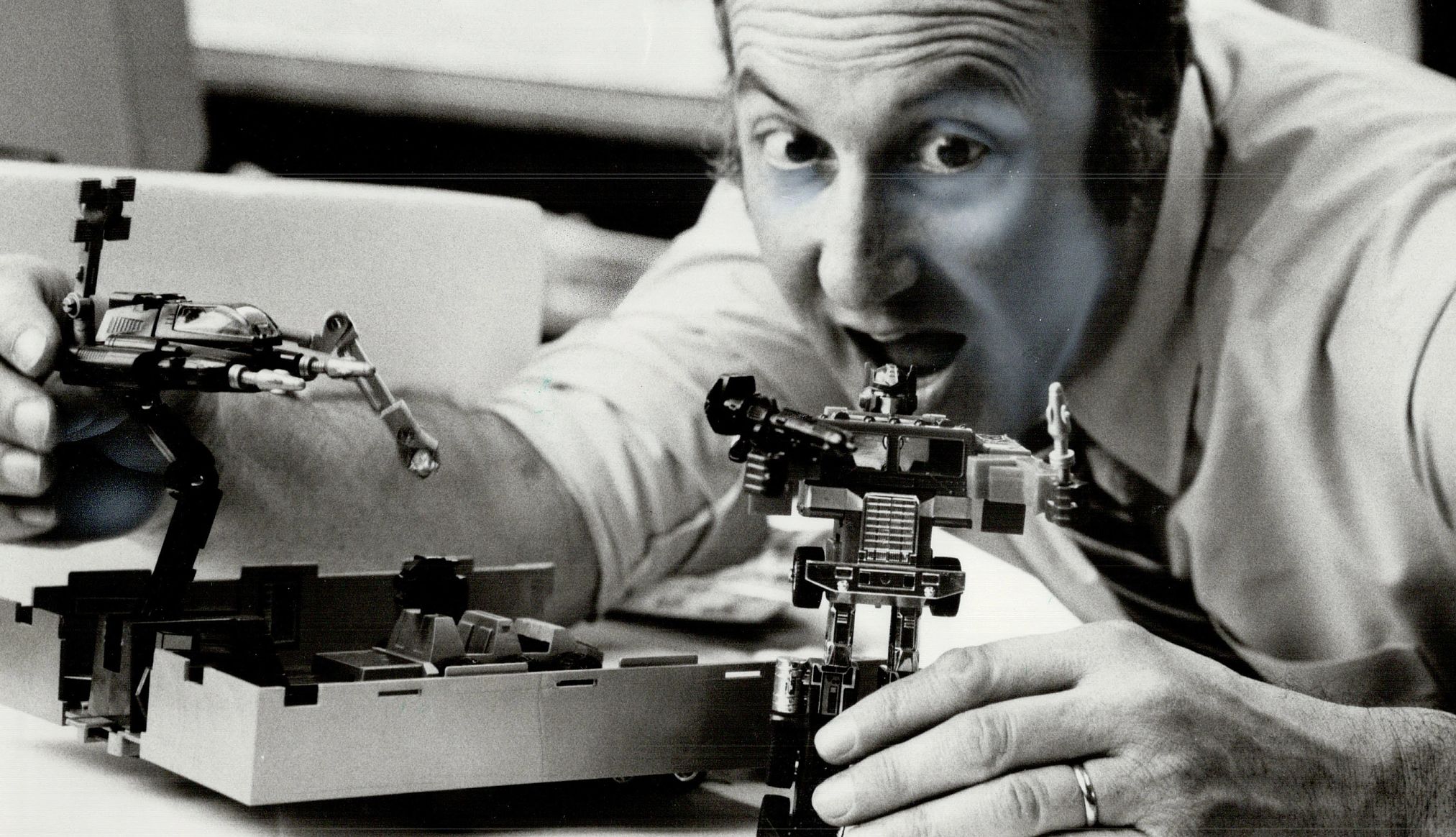 National Toy Hall of Fame Inducts 3 Classics a person is playing with a transformer toy