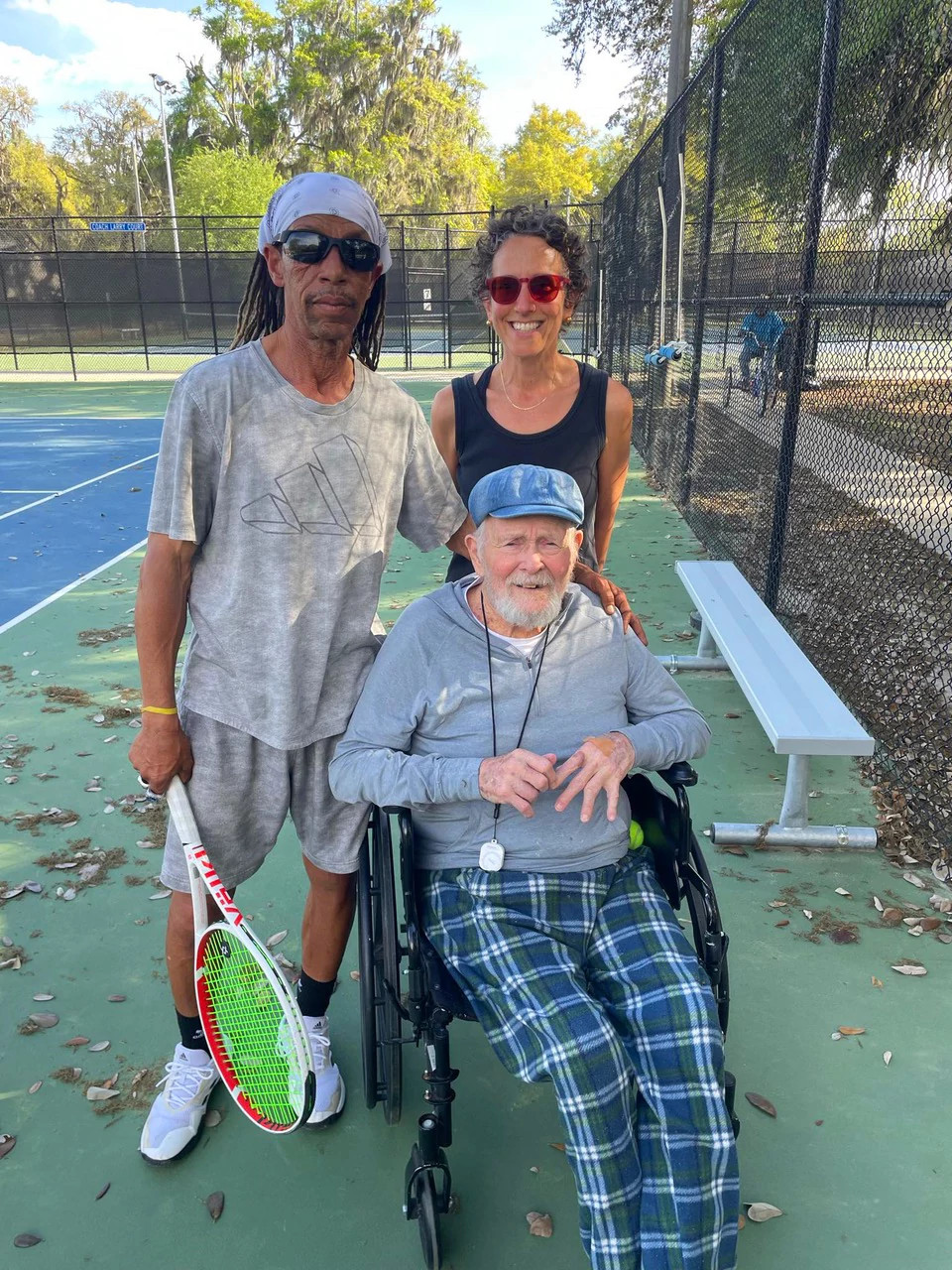 A photo shows Jennifer Margulis, Bill Patton and tennis pro Larry Scheper