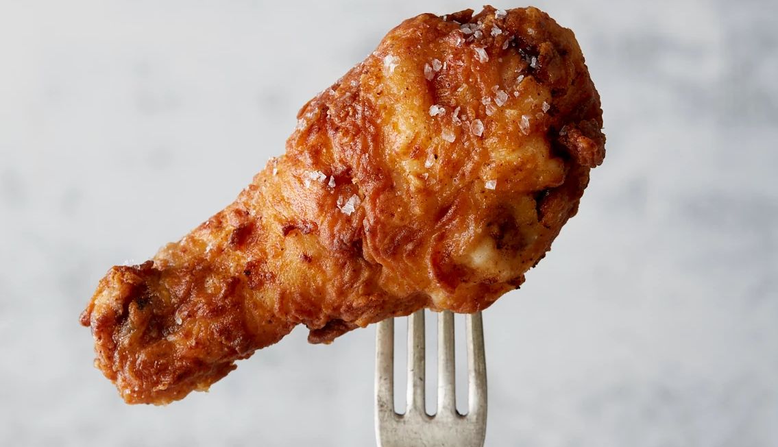 Mark Bittman’s Summer Menu A fried chicken leg on a fork