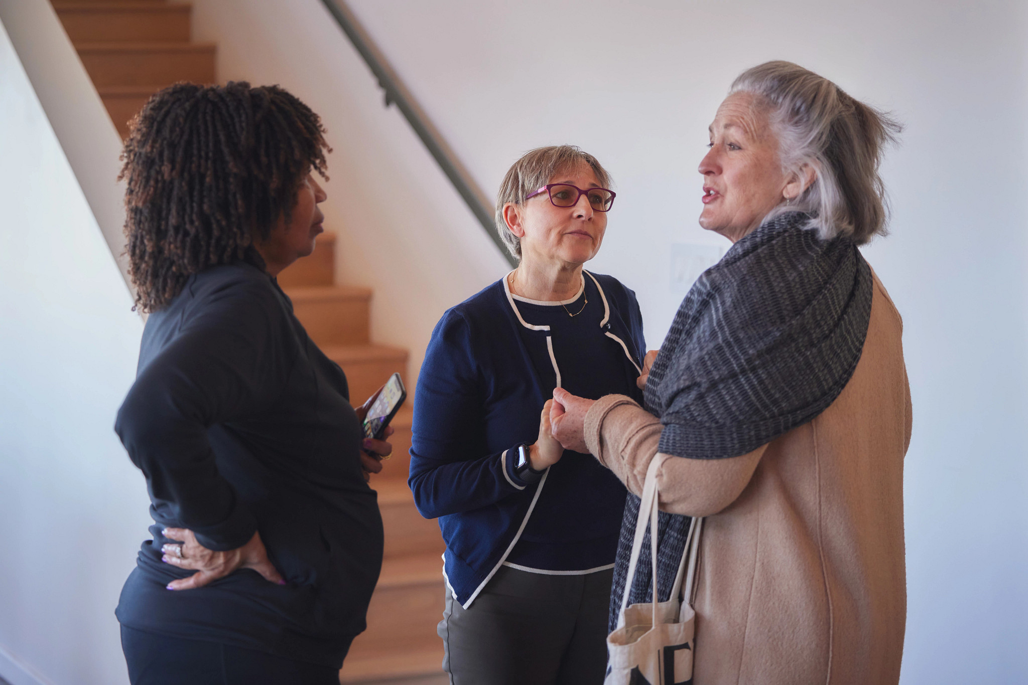 a photo shows Verna Avery Brown, Eve Blossom and Martha Morrill saying their farewells after the workshop