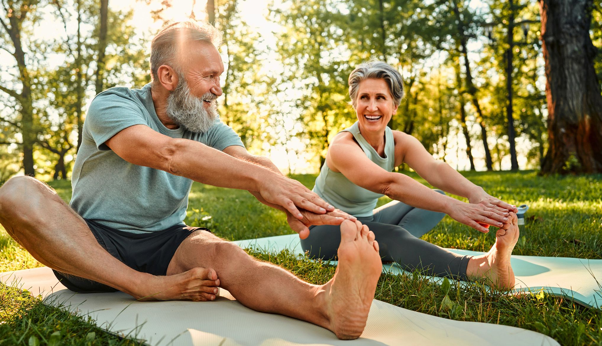 Parkinson’s Disease Self-Care couple stretching outdoors