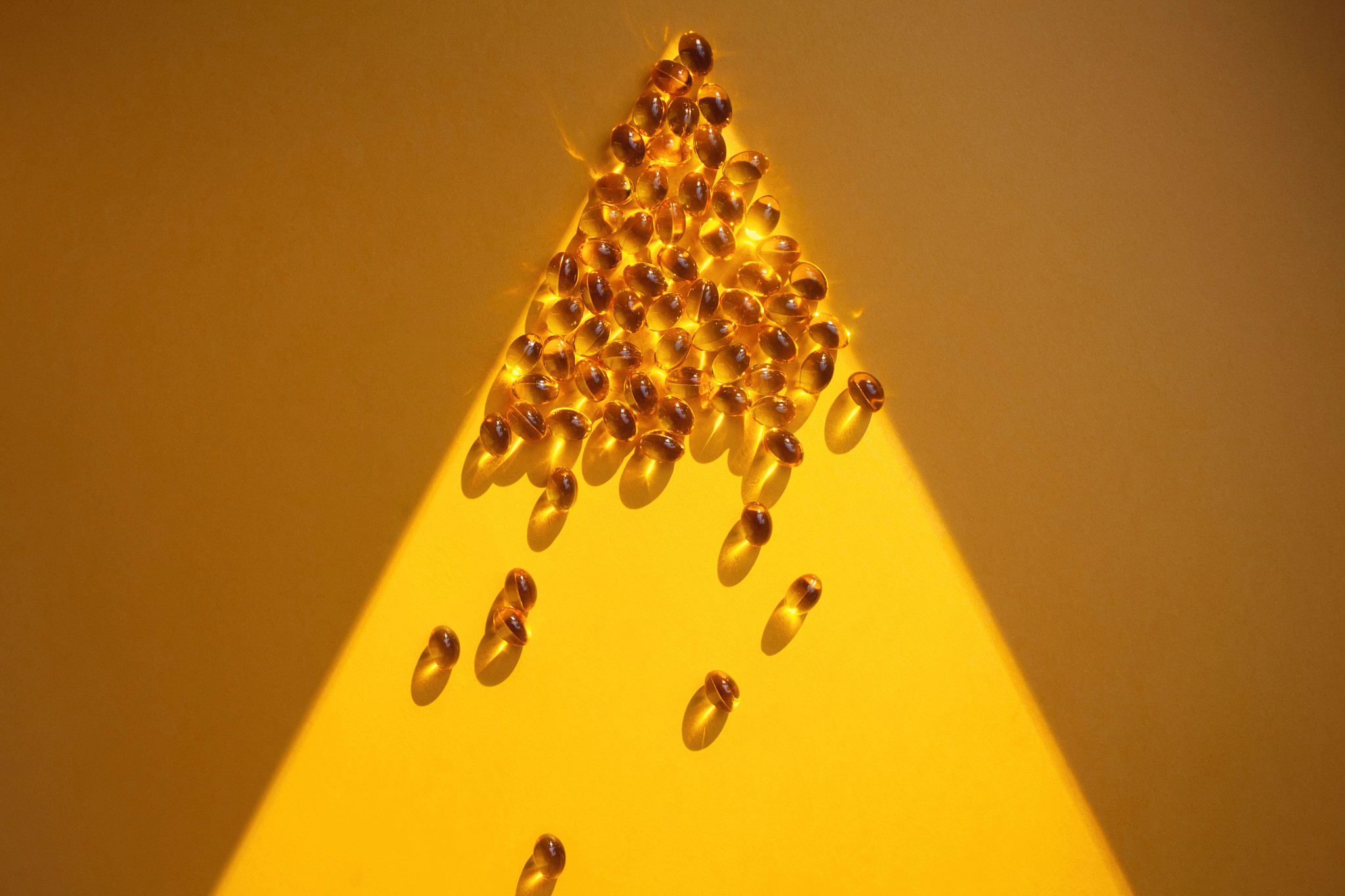 Vitamin capsules in a ray of light