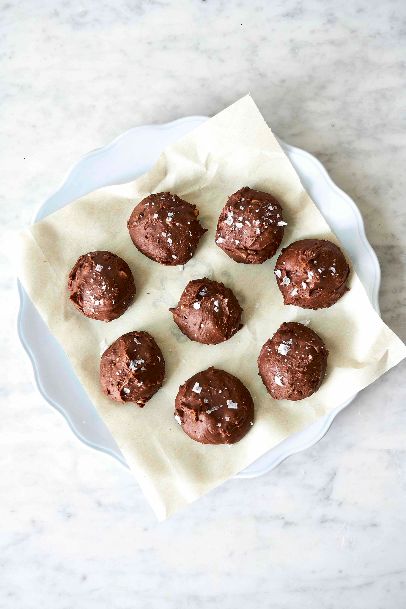 A photo with an overhead view shows salted chocolate peanut butter bonbons on a serving dish
