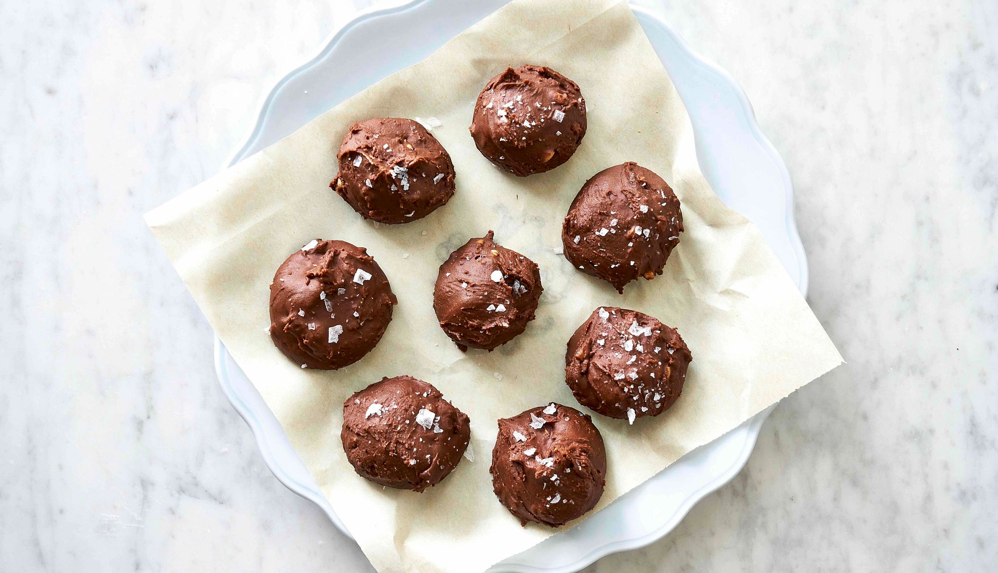 Mark Bittman's Salted Chocolate Peanut Butter Bonbons A photo with an overhead view shows salted chocolate peanut butter bonbons on a serving dish