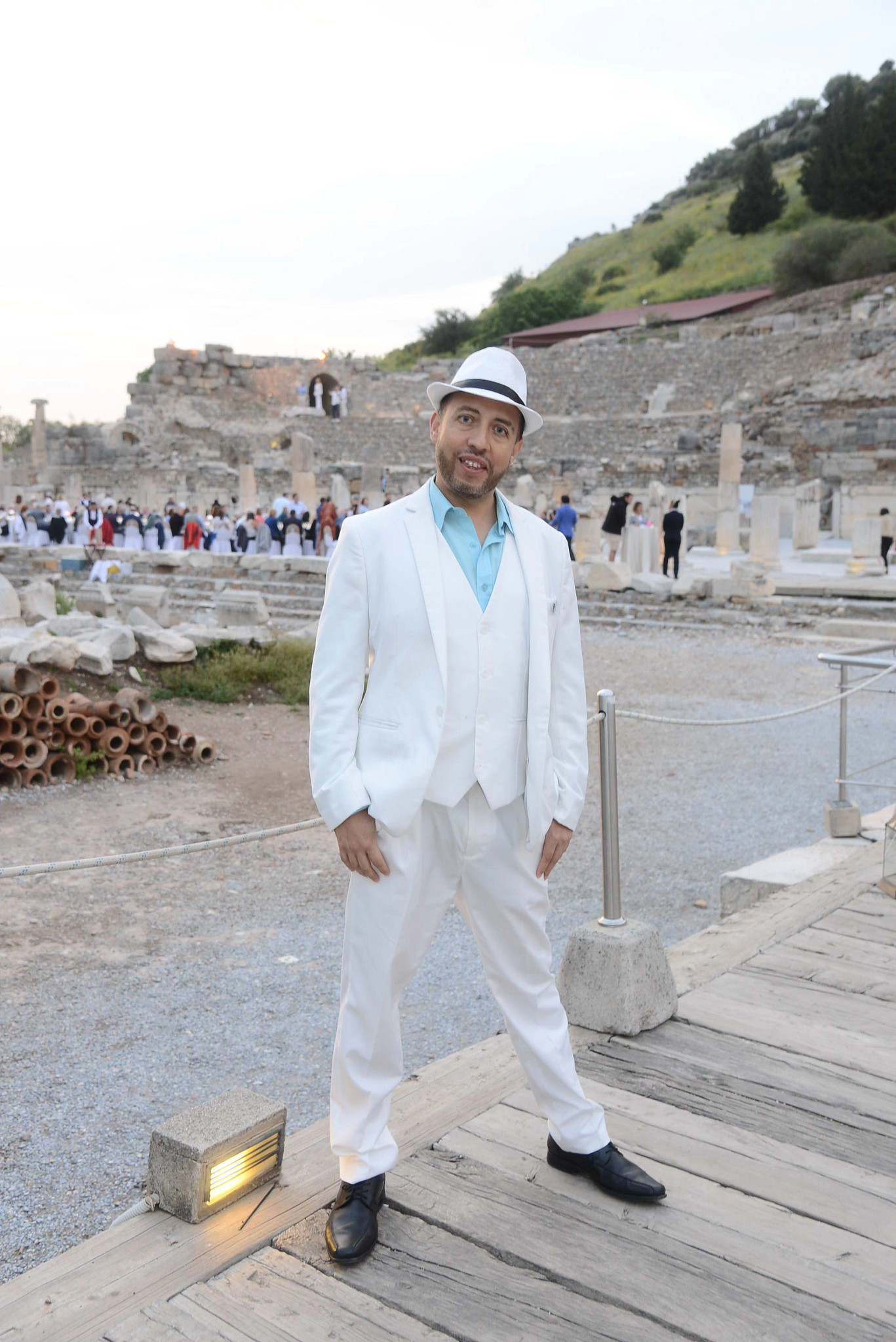 a man posing at a landmark in Ephesus, Turkey