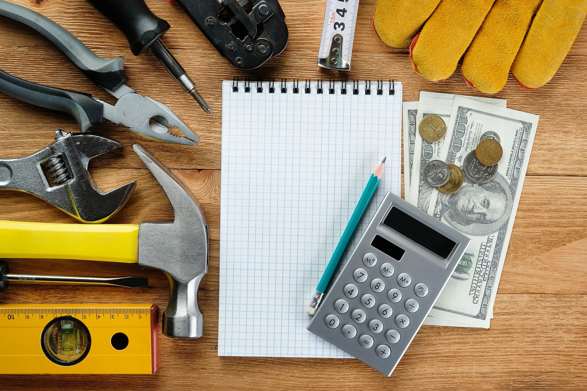 Contractor tools sitting on a wooden table