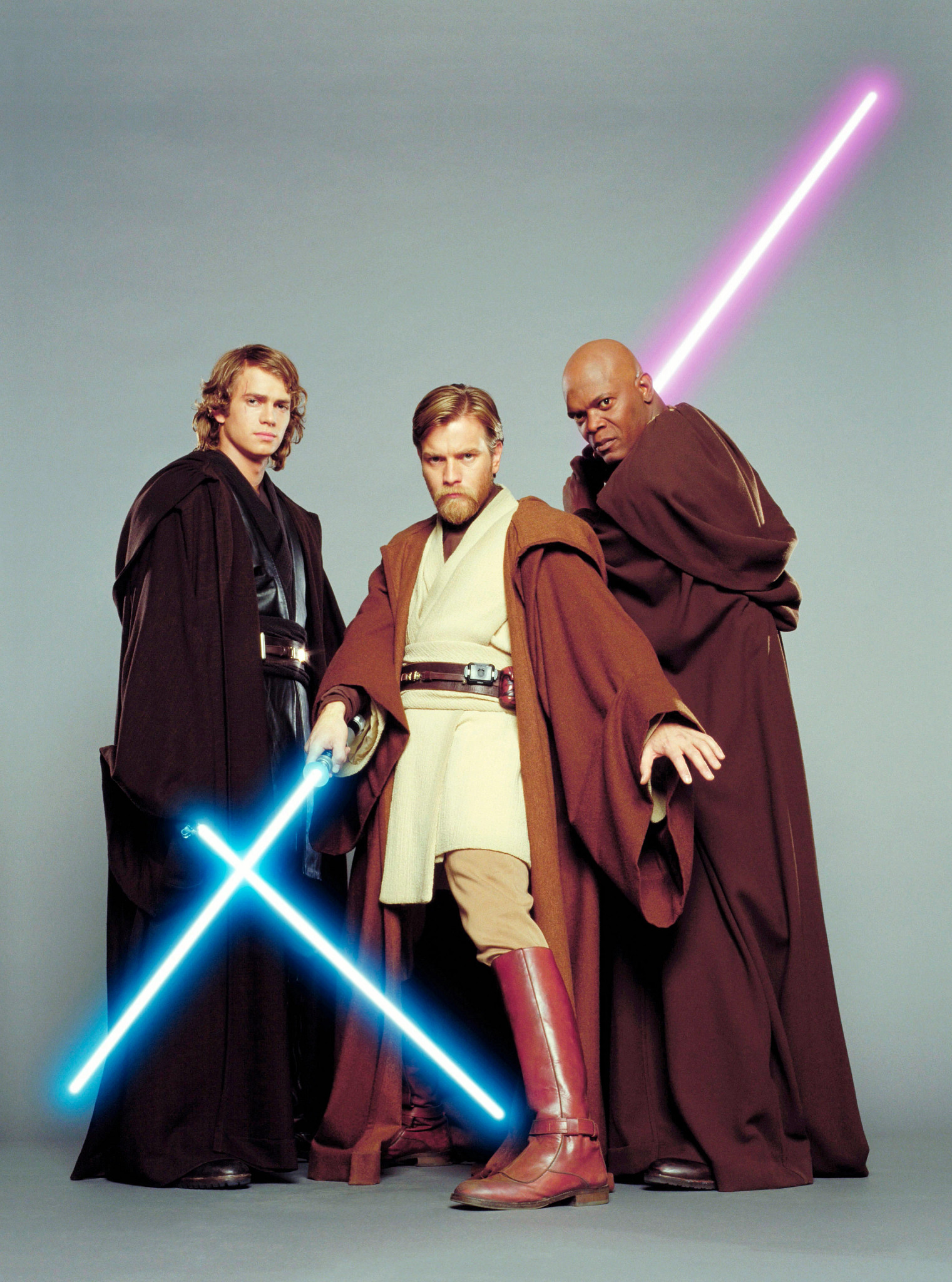 Hayden Christensen, Ewan McGregor and Samuel L. Jackson brandishing lightsabers