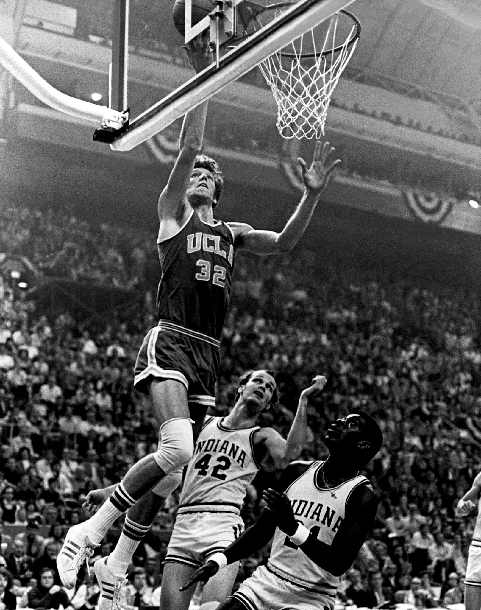 Bill Walton playing for UCLA makes a layup in a game against Indiana University in 1973