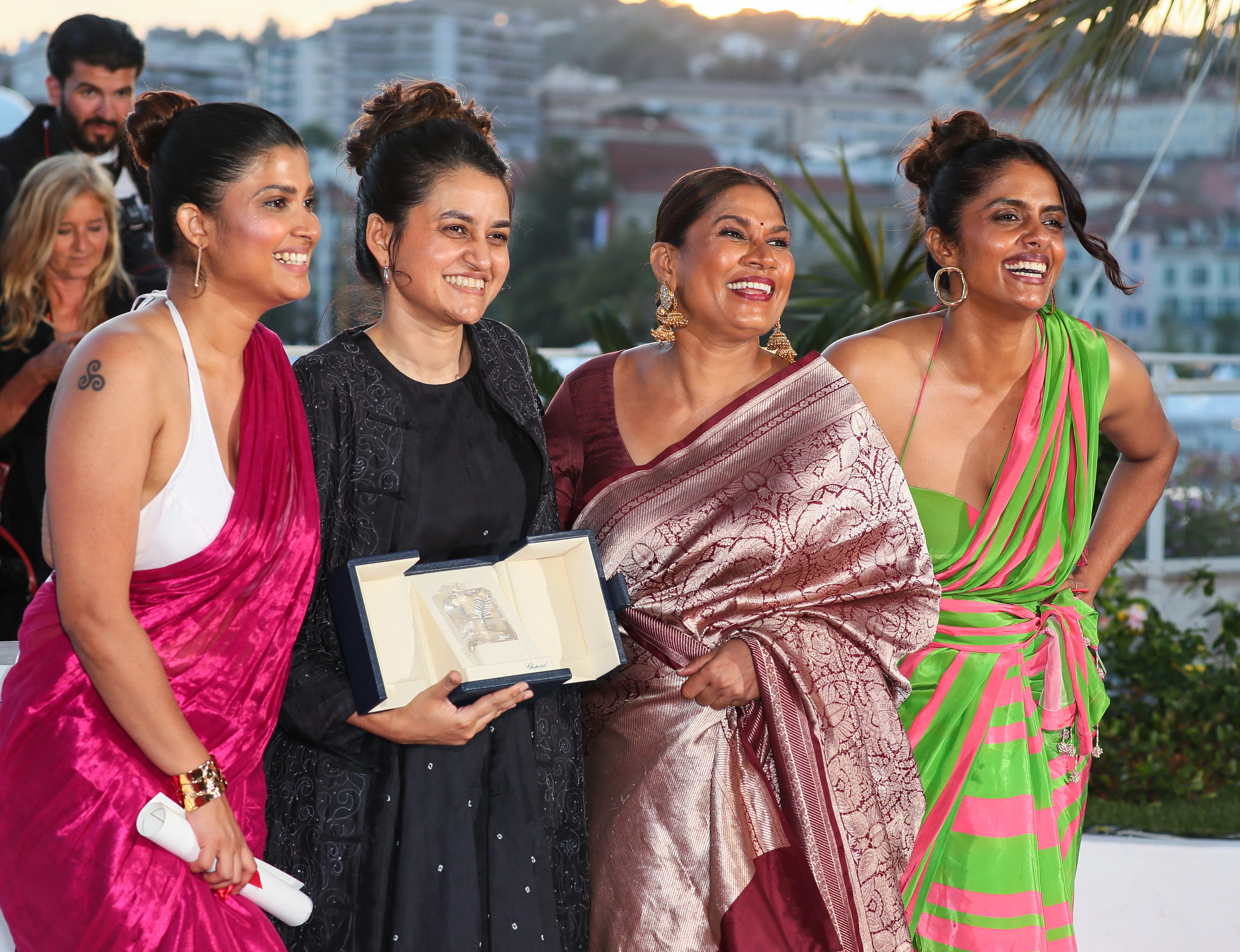Divya Prabha, Payal Kapadia, Chhaya Kadam and Kani Kusruti pose together with the Grand Prix Award at the 77th Cannes Film Festival