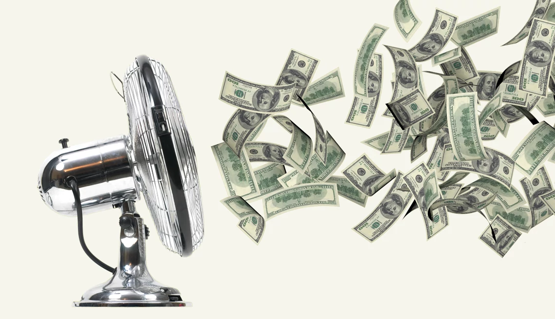 Ways to Spend Less on Summer Electric Bills a fan with money flying into it