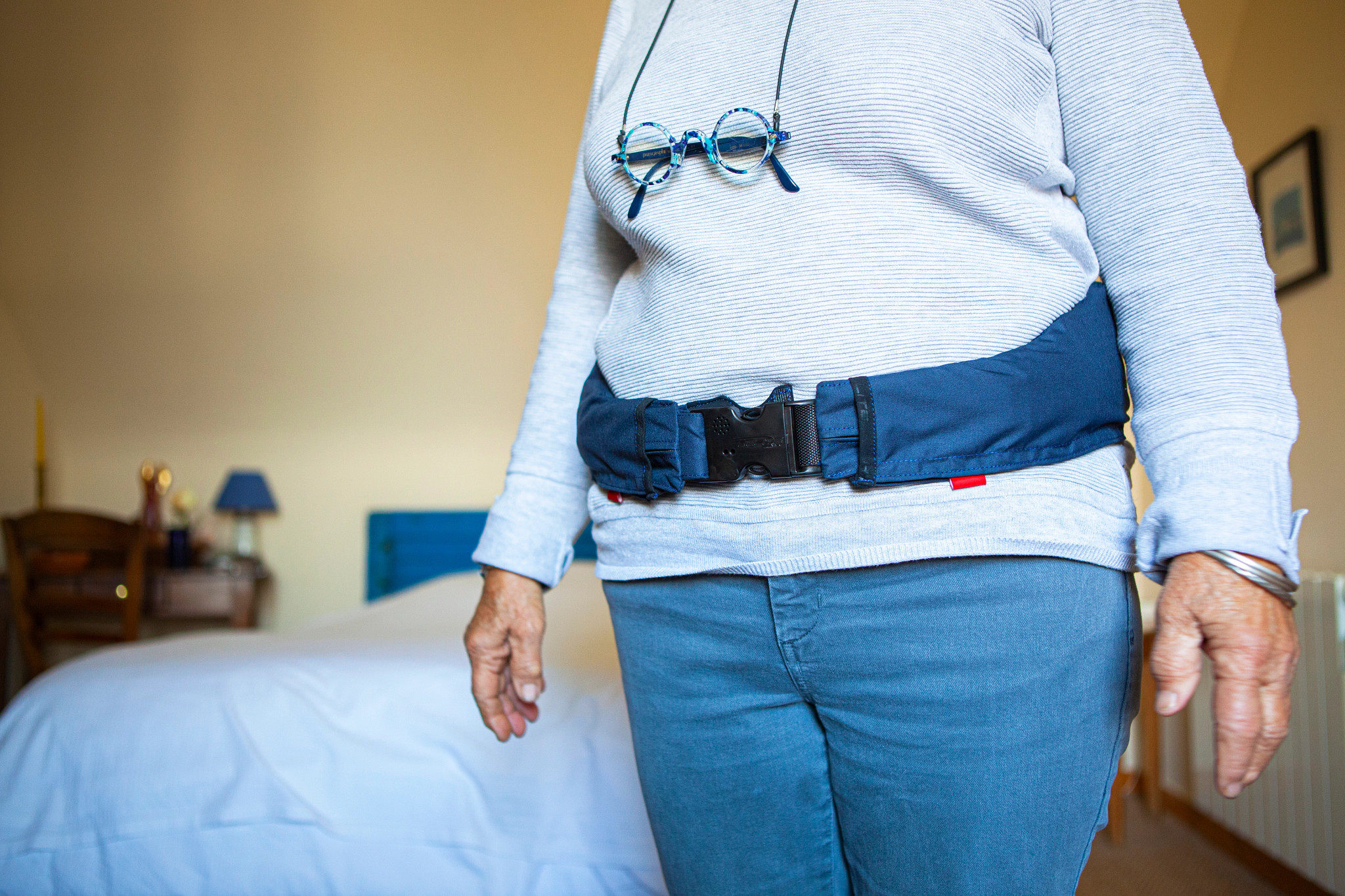 A photo shows a woman wearing a Helite HipGuard, a wearable airbag for your hips. It inflates during a fall to turn a hard landing into a soft one.