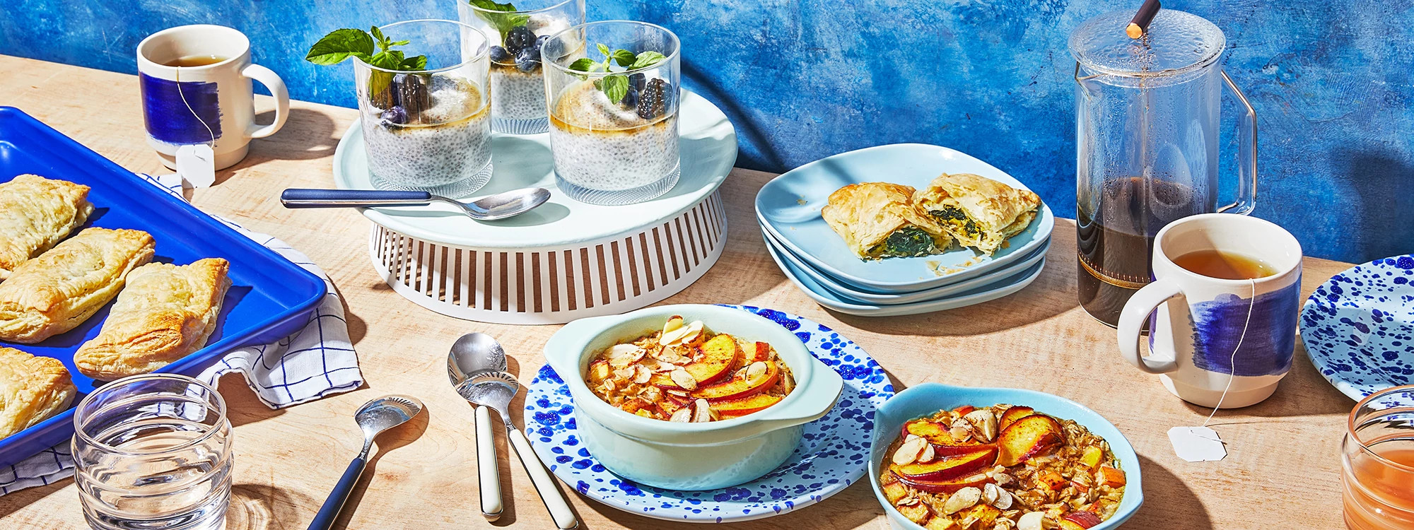 Multiple quick breakfast items on a kitchen counter with blue plates and trays